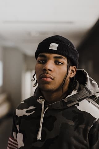 A handsome guy on a cozy cap.